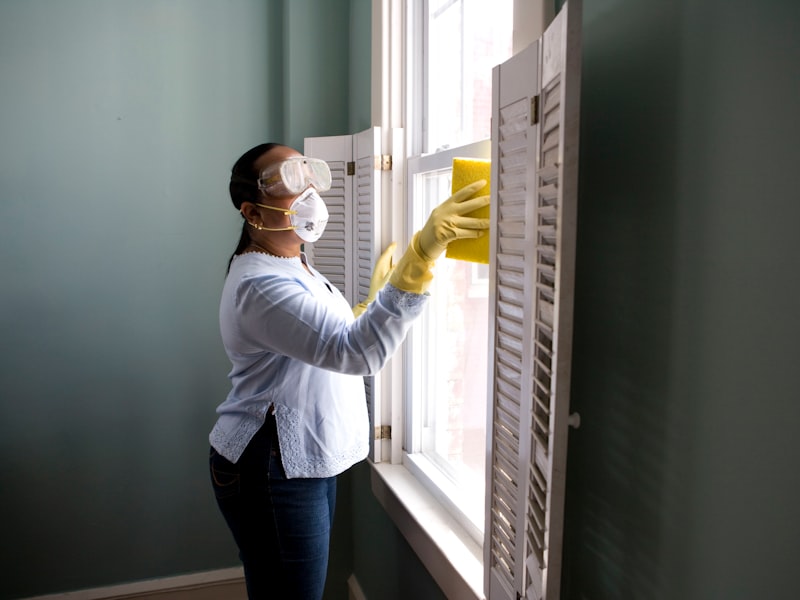 Carer helping maintain a tidy and safe home environment